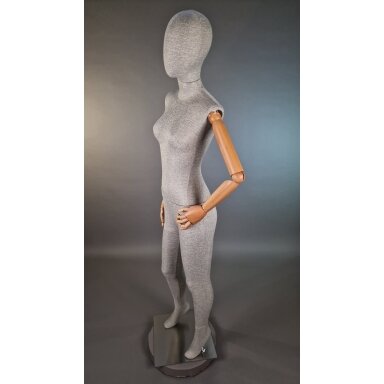 Mannequin T67 with wooden arms, covered in linen fabric, female full-body. Designed for displaying clothing in stores, sales areas, and exhibitions. Mannequin T67 with wooden arms, covered in linen fabric, female full-body. Designed for displaying clothing in stores, sales areas, and exhibitions.